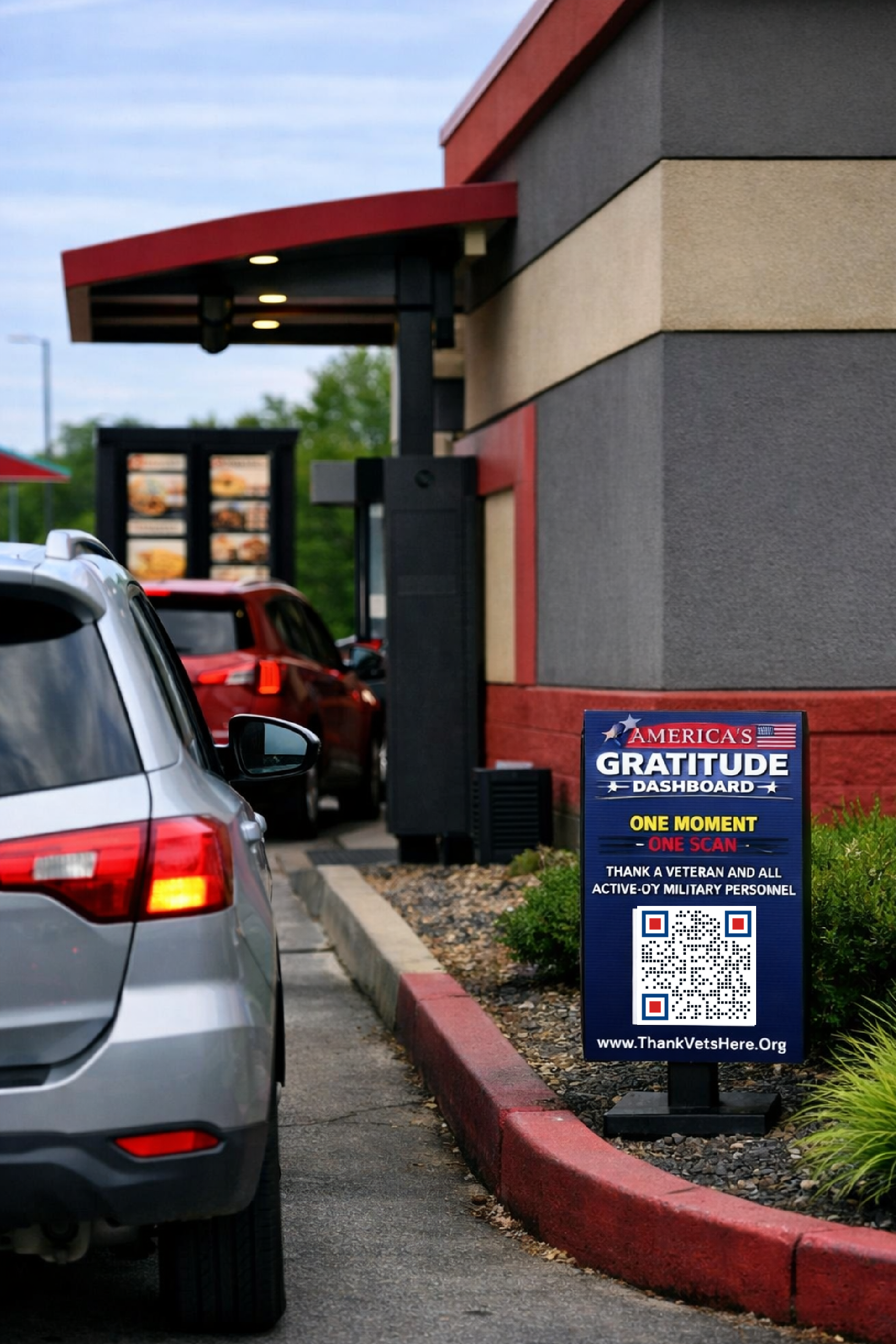 America's Gratitude Dashboard sign displayed beside a drive-thru lane